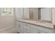 Bathroom features double sinks with granite countertops, tiled floors and a walk-in shower at 52 Brunello Ct, Clayton, NC 27527