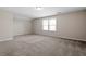 Large bedroom features plush carpeting, a neutral color palette and ample natural light at 52 Brunello Ct, Clayton, NC 27527