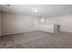 Spacious bonus room with neutral carpet and paint is ready for a new owner at 52 Brunello Ct, Clayton, NC 27527