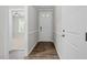 Bright and airy entrance hall with hardwood floors and white trim, offering a welcoming first impression at 52 Brunello Ct, Clayton, NC 27527