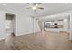 Spacious living area with hardwood floors seamlessly connecting the living room and kitchen for easy entertaining at 52 Brunello Ct, Clayton, NC 27527