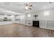 Inviting living room with fireplace, built-in shelves, and a seamless transition to the kitchen, perfect for modern living at 52 Brunello Ct, Clayton, NC 27527