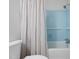 Bathroom shower with blue tile, white shower curtain and assist bar at 526 Colony Woods Dr, Chapel Hill, NC 27517