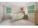 Bedroom featuring windows, neutral walls and carpeting, and queen bed at 526 Colony Woods Dr, Chapel Hill, NC 27517