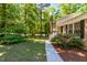Well-maintained lawn and landscaping highlight the home's exterior, leading to a charming entrance at 526 Colony Woods Dr, Chapel Hill, NC 27517