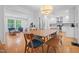 Open concept kitchen and dining area with modern appliances and hardwood flooring at 526 Colony Woods Dr, Chapel Hill, NC 27517
