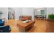 Open-concept living area with hardwood floors and seamless transition to dining space, perfect for modern living at 526 Colony Woods Dr, Chapel Hill, NC 27517