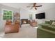 Cozy living room featuring a fireplace, a large TV, and a comfortable seating area at 526 Colony Woods Dr, Chapel Hill, NC 27517