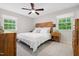 Spacious bedroom with light-colored walls, carpeted floors, and lots of natural light at 526 Colony Woods Dr, Chapel Hill, NC 27517