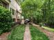 Well-manicured backyard with brick walkway, patio area, and mature landscaping at 5317 Deep Valley, Raleigh, NC 27606