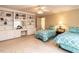 Bedroom area with built-in shelving, twin beds, and a ceiling fan at 5317 Deep Valley, Raleigh, NC 27606