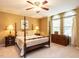 Bedroom with a four-poster bed and two windows at 5317 Deep Valley, Raleigh, NC 27606