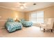 Bright bedroom featuring two twin beds, a large window and a comfortable armchair at 5317 Deep Valley, Raleigh, NC 27606