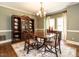 Formal dining room with hardwood floors, chandelier, and ample natural light at 5317 Deep Valley, Raleigh, NC 27606