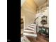 Elegant entryway featuring hardwood floors, stairs with white risers, and traditional decor elements at 5317 Deep Valley, Raleigh, NC 27606
