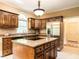 Spacious kitchen with stainless steel appliances, granite countertops, and a central island cooktop at 5317 Deep Valley, Raleigh, NC 27606
