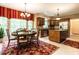 Eat-in kitchen with stainless steel appliances, center island, and large windows for natural light at 5317 Deep Valley, Raleigh, NC 27606