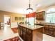 Well-appointed kitchen with a center island, granite countertops, and stainless steel appliances at 5317 Deep Valley, Raleigh, NC 27606