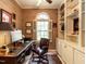 Cozy office with built-in shelving, a window seat, and a classic wooden desk at 5317 Deep Valley, Raleigh, NC 27606
