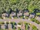 Overhead shot of well-kept homes with mature trees and landscaping in a peaceful suburban neighborhood at 533 Opposition Way, Wake Forest, NC 27587