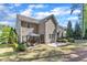 Two-story home featuring a gravel patio and deck for entertaining in the backyard at 533 Opposition Way, Wake Forest, NC 27587
