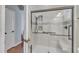 Modern bathroom featuring a glass-enclosed shower with subway tile and built-in seat at 533 Opposition Way, Wake Forest, NC 27587