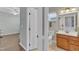 Attached bath and vanity with granite countertops, and modern fixtures at 533 Opposition Way, Wake Forest, NC 27587