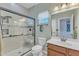 Modern bathroom featuring a glass-enclosed shower with subway tile and built-in seat at 533 Opposition Way, Wake Forest, NC 27587