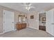 Cozy bedroom with a ceiling fan, neutral walls, carpeted floors, two doors and a window at 533 Opposition Way, Wake Forest, NC 27587