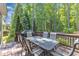 Outdoor deck is perfect for entertaining with dining table and chairs at 533 Opposition Way, Wake Forest, NC 27587