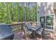 View of the deck from the side of the house complete with grill and dining set at 533 Opposition Way, Wake Forest, NC 27587