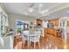 Cozy dining area with a view of the outdoor patio, a large table, and natural light at 533 Opposition Way, Wake Forest, NC 27587