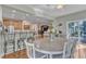 Open-concept dining area with wood floors is adjacent to the kitchen and offers easy access to other living spaces at 533 Opposition Way, Wake Forest, NC 27587