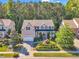 Aerial view of a two-story home with an attached garage and a beautifully landscaped front yard in a lovely neighborhood at 533 Opposition Way, Wake Forest, NC 27587