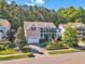 Aerial view of a two-story home with an attached garage and a beautifully landscaped front yard in a lovely neighborhood at 533 Opposition Way, Wake Forest, NC 27587