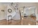 Spacious foyer with hardwood floors, staircase, and views into the living spaces at 533 Opposition Way, Wake Forest, NC 27587