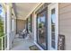 Inviting front porch with rocking chair, side table, and 'Welcome' sign, perfect for relaxing at 533 Opposition Way, Wake Forest, NC 27587