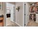 Hallway showing the closet and bathroom. Interior features include neutral walls and carpeted floors at 533 Opposition Way, Wake Forest, NC 27587