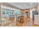 Spacious kitchen with granite countertops, island seating, and an adjacent dining area at 533 Opposition Way, Wake Forest, NC 27587