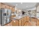 Modern kitchen with stainless steel appliances, granite counters, and an open layout at 533 Opposition Way, Wake Forest, NC 27587