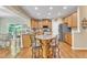 Well-lit kitchen featuring granite countertops, wooden cabinets, and stainless steel appliances at 533 Opposition Way, Wake Forest, NC 27587