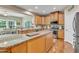 Open-concept kitchen featuring an island, stainless steel appliances, and plenty of cabinet space at 533 Opposition Way, Wake Forest, NC 27587