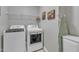 Well-equipped laundry room with modern washer, dryer, and functional storage solutions at 533 Opposition Way, Wake Forest, NC 27587