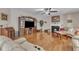 Inviting living room featuring hardwood floors, a cozy fireplace, and comfortable seating at 533 Opposition Way, Wake Forest, NC 27587