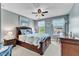 Cozy main bedroom features a ceiling fan, soft natural light, and neutral paint at 533 Opposition Way, Wake Forest, NC 27587