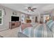 Spacious main bedroom featuring a bed, large windows, ceiling fan, and a large walk-in closet at 533 Opposition Way, Wake Forest, NC 27587