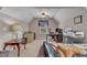 This bonus room offers a home office with a desk, chair and soft neutral walls at 533 Opposition Way, Wake Forest, NC 27587
