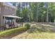 View of the patio with a built-in fire pit in the backyard at 533 Opposition Way, Wake Forest, NC 27587