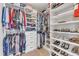 This walk-in closet boasts custom shelving, built-in drawers and ample storage space for clothes and accessories at 533 Opposition Way, Wake Forest, NC 27587