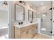 Modern bathroom with double vanity, walk-in shower, and stylish fixtures at 56 Birchtop Cir, Zebulon, NC 27597